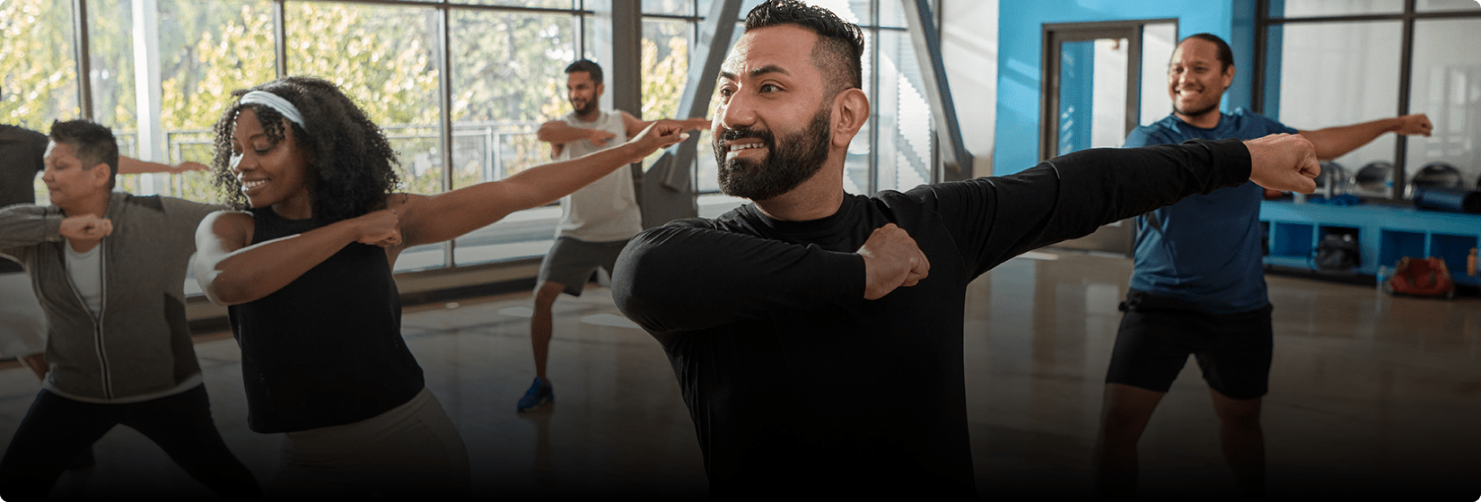 Elias is working out in a group class.